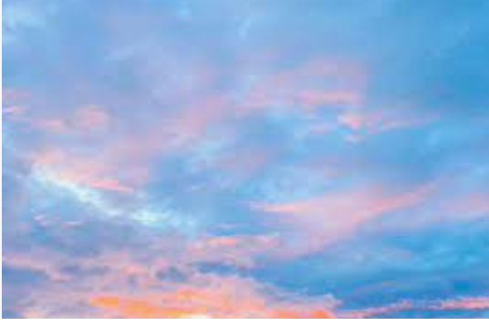 Pastel sunset sky over the field